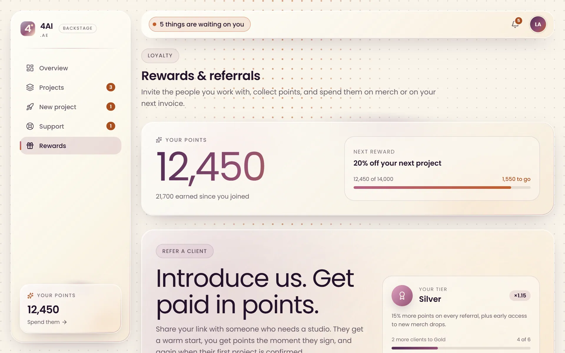The Backstage rewards page with the points balance, the next reward and the referral panel
